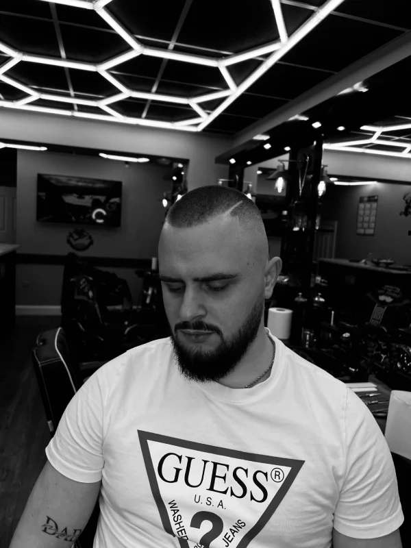 A guy's front view after a haircut and beard trim