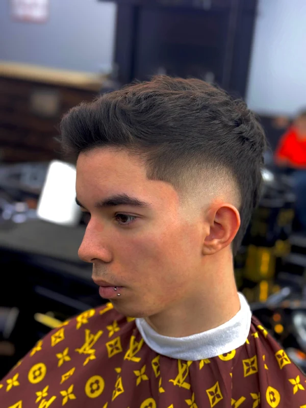 Front side view of a guy with a new fade haircut