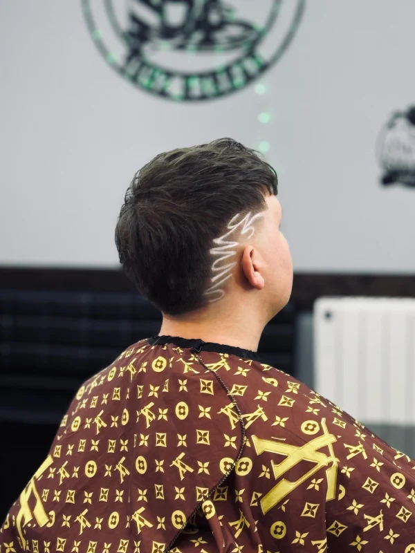 Guy with a hair design from the back