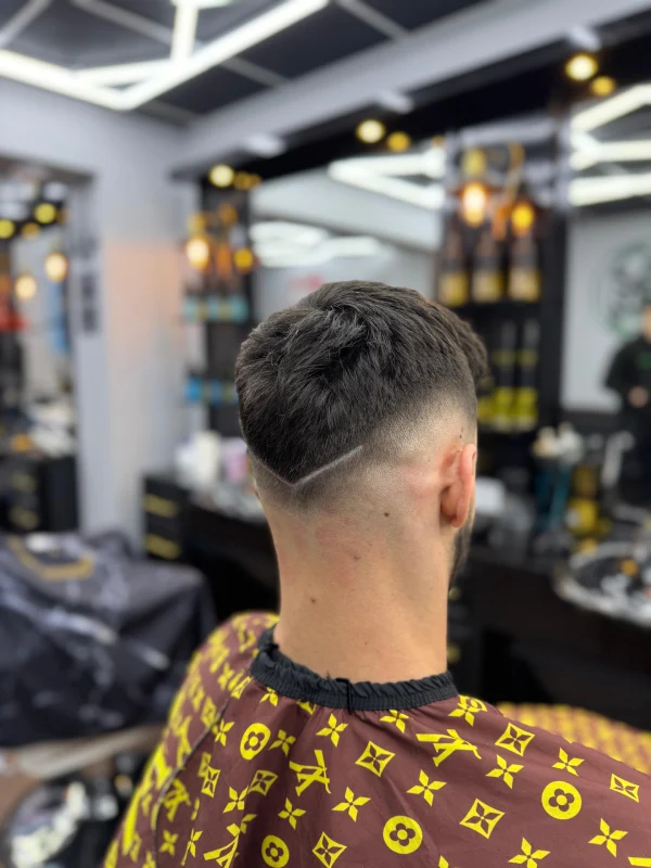 The back of a guy after a haircut at 91' Janau barbershop